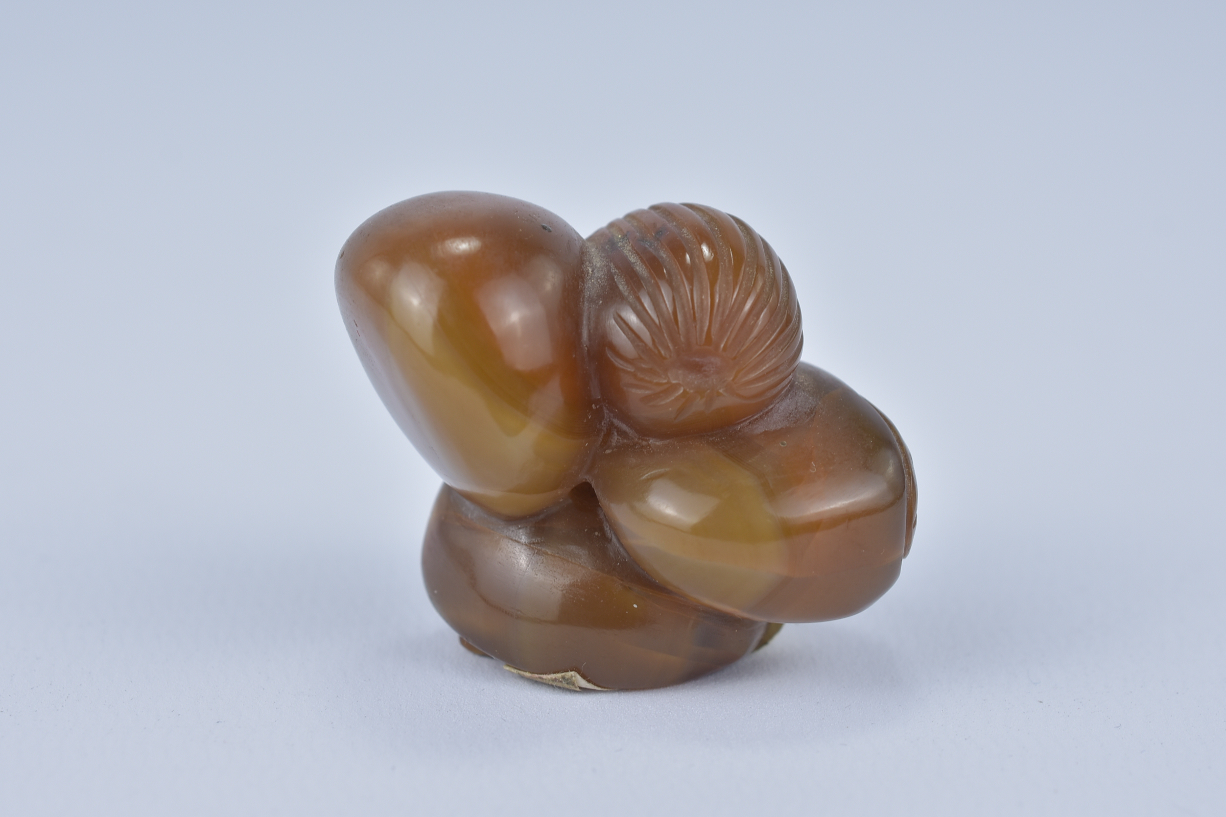 A Chinese 19th century Agate Pendant carved as a cluster of nuts. 3.5cm x 3cm. Purchased between 197 - Image 3 of 5