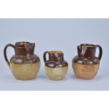 Three Royal Doulton Lamberth Stoneware Jugs. 11.4cm tall, 14cm tall, 14.5cm tall (3)