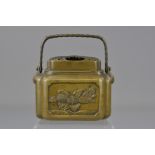 A Japanese 19th century bronze hand warmer with handle, signed. 12cm (D)