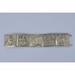 An antique Indian Hindi Silver panel bracelet with five panels of Hindu Gods.