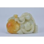 A Chinese carved Celadon and russet Jade Ram. 10cm x 6cm