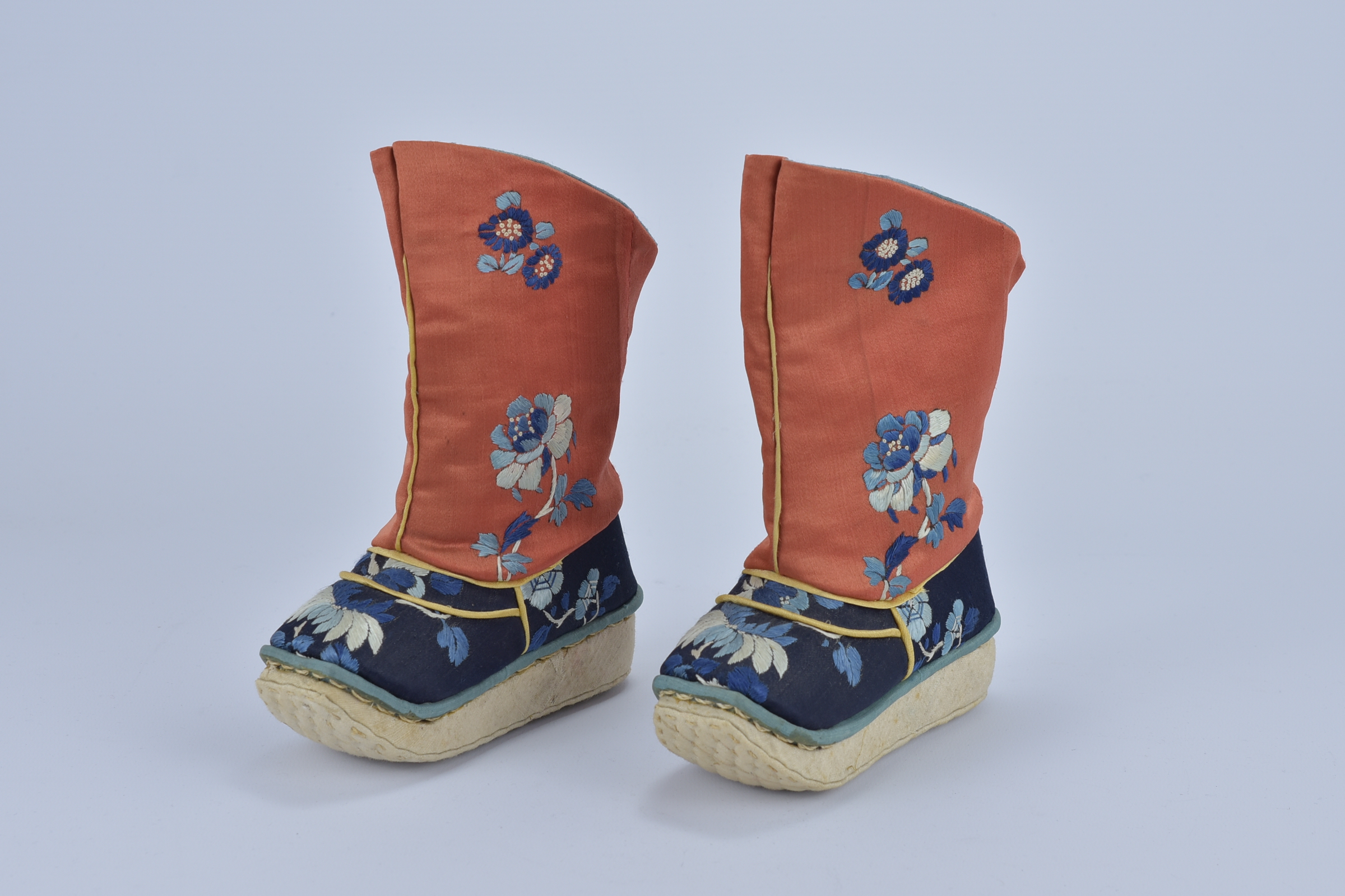 A nice Pair of Chinese 20th century red and blue Embroidered Children boots with floral and butterfl