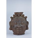 A very large Nepalese terracotta jar formed as a Bhairava mask adorned with skulls. 56cm tall 40cm d