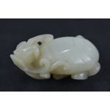 A Chinese Carved Jade Pendant Dragon and Peach. 5cm x 3cm
