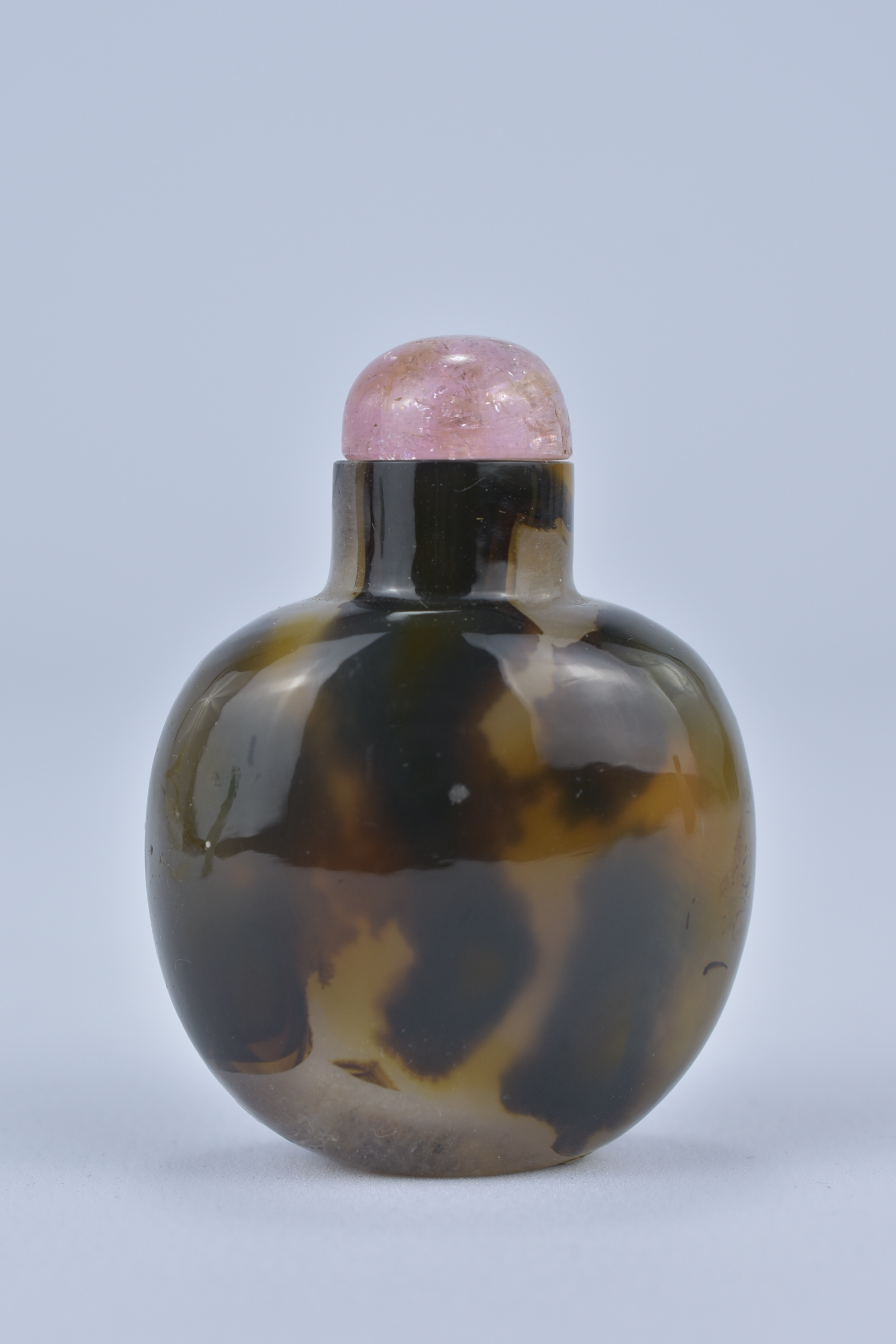 A Chinese yellow and brown Agate Snuff Bottle with pink quartz Stopper. 5cm tall. Purchased between