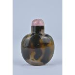 A Chinese yellow and brown Agate Snuff Bottle with pink quartz Stopper. 5cm tall. Purchased between