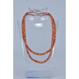 A Coral beaded necklace with Silver Clasp.