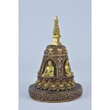 Four facing bronze gilded Tibetan seated Buddha on lotus stand with pagoda. 16cm tall