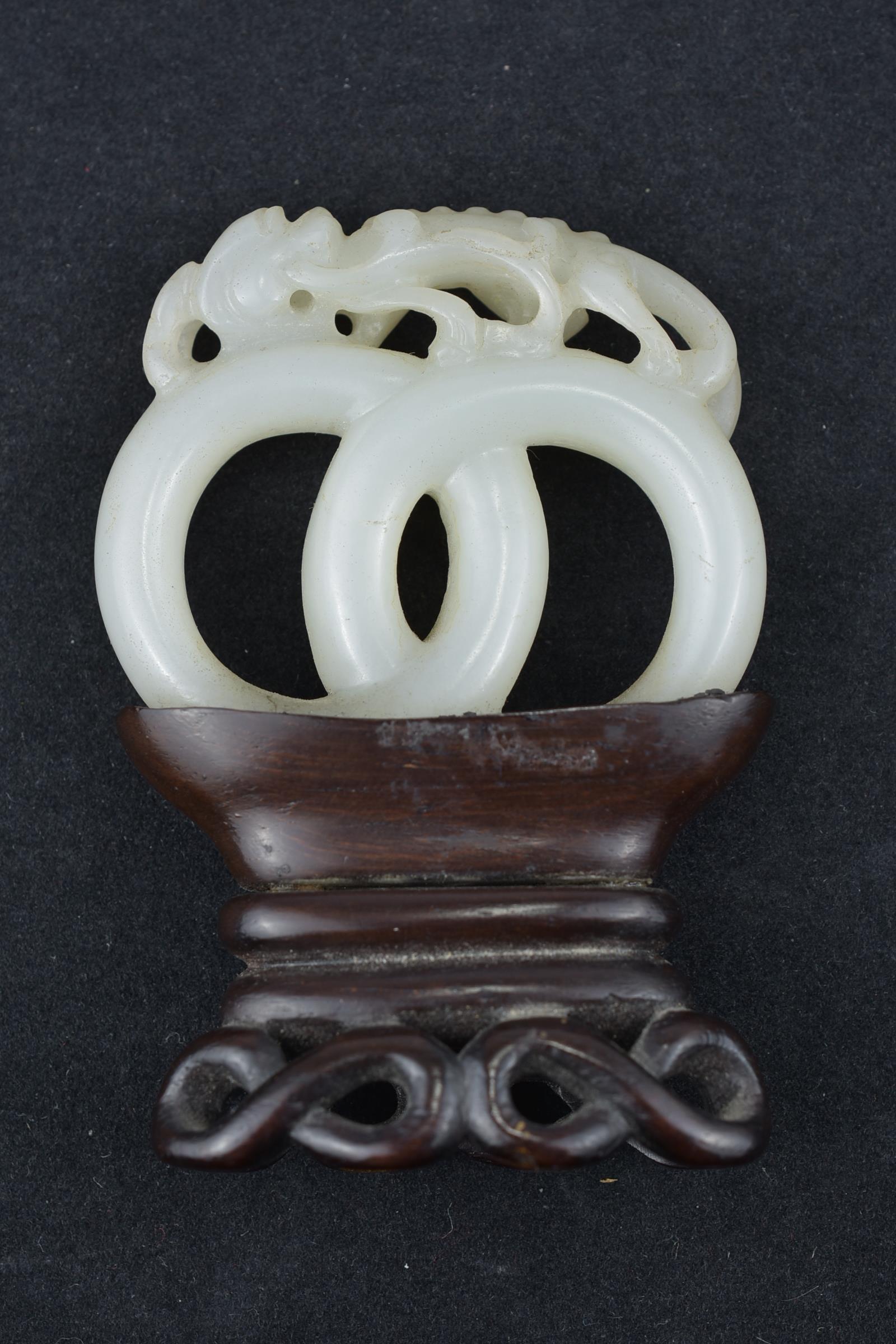 A 19th century Chinese carved White Jade joined rings surmounted by a dragon attached to wooden stan - Image 5 of 13