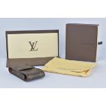 Louis Vuitton Paris France Cigarette Case boxed with dust bag and original purchase receipt.