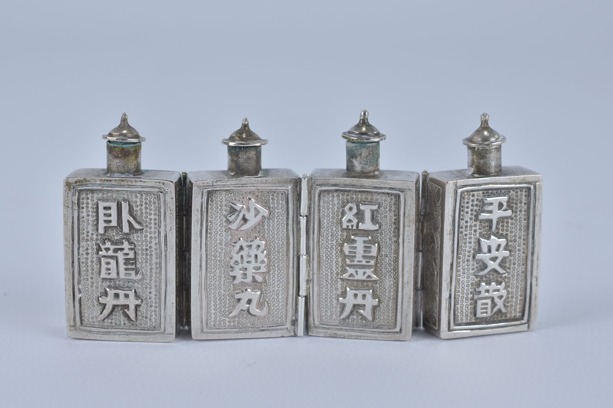 An early 20th Century Chinese export Silver on brass medicine bottles with Inscription. 8cm