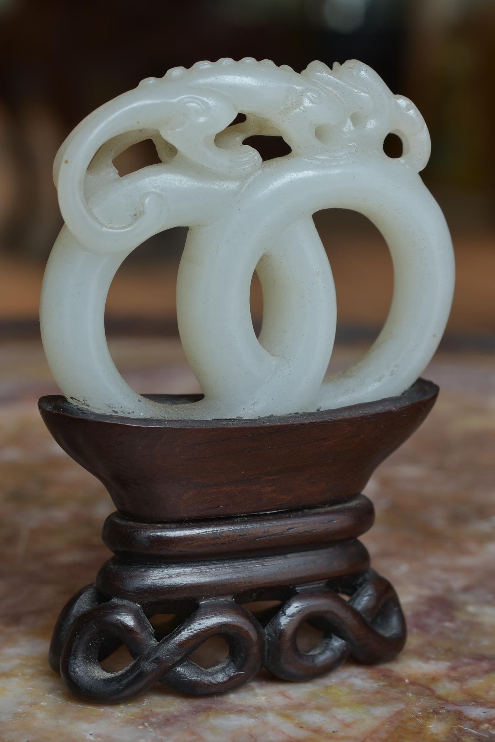 A 19th century Chinese carved White Jade joined rings surmounted by a dragon attached to wooden stan - Image 8 of 13