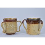 Two Royal Doulton Lambeth stoneware Three-Handle Loving Cups. 15cm tall x 13.5cm diameter, 16.6cm ta