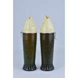 Two white wine 'Fruidmer' 1960s fish glass bottles with fish head covers. Slight damage to one cover