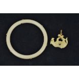 An Ivory Bangle inserted with 18k gold (stamped) with six sapphire stones in gold mounts together wi