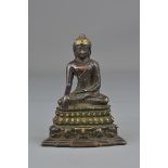 A Tibetan 18th/19th century bronze seated Buddha on lotus stand. 13 cm tall.