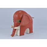 A retro red and white leather elephant. Slight ware to body and small hole to underneath. 33cm Tall