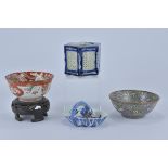 Four Japanese porcelain items and one wooden stand 12.9cm, 13.9cm, 12.5cm, 11cm (4)