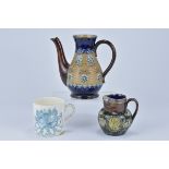 Three Royal Doulton items. Including one pot, a jug and porcelain mug. 10.5cm tall, 7.8cm tall, 8.8c