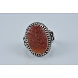A Persian Agate Ring with carved Islamic script stamps to ring. Size U/V