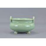 A Chinese 19th century celadon porcelain tripod censer. 13 cm diameter.