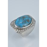 A large Turquoise and silver ring stamped 925. Size R