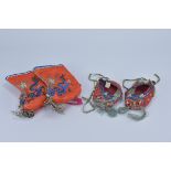 A pair of Chinese 20th century Embroidered Children dragon slippers together with a later pair of em