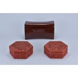 Two Chinese red Lacquer Boxes with floral pattern designs together with a Lacquer Pillow 15cm x 6.5c