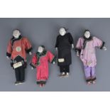 A collection of four Chinese early 20th century merchant / opera dolls in original dress.