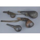 Four antique Middle Eastern ottoman gun powder flasks.