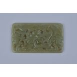 A Chinese carved Jadeite plaque carved and pierced with Birds and  foliage. 10cm x 6cm