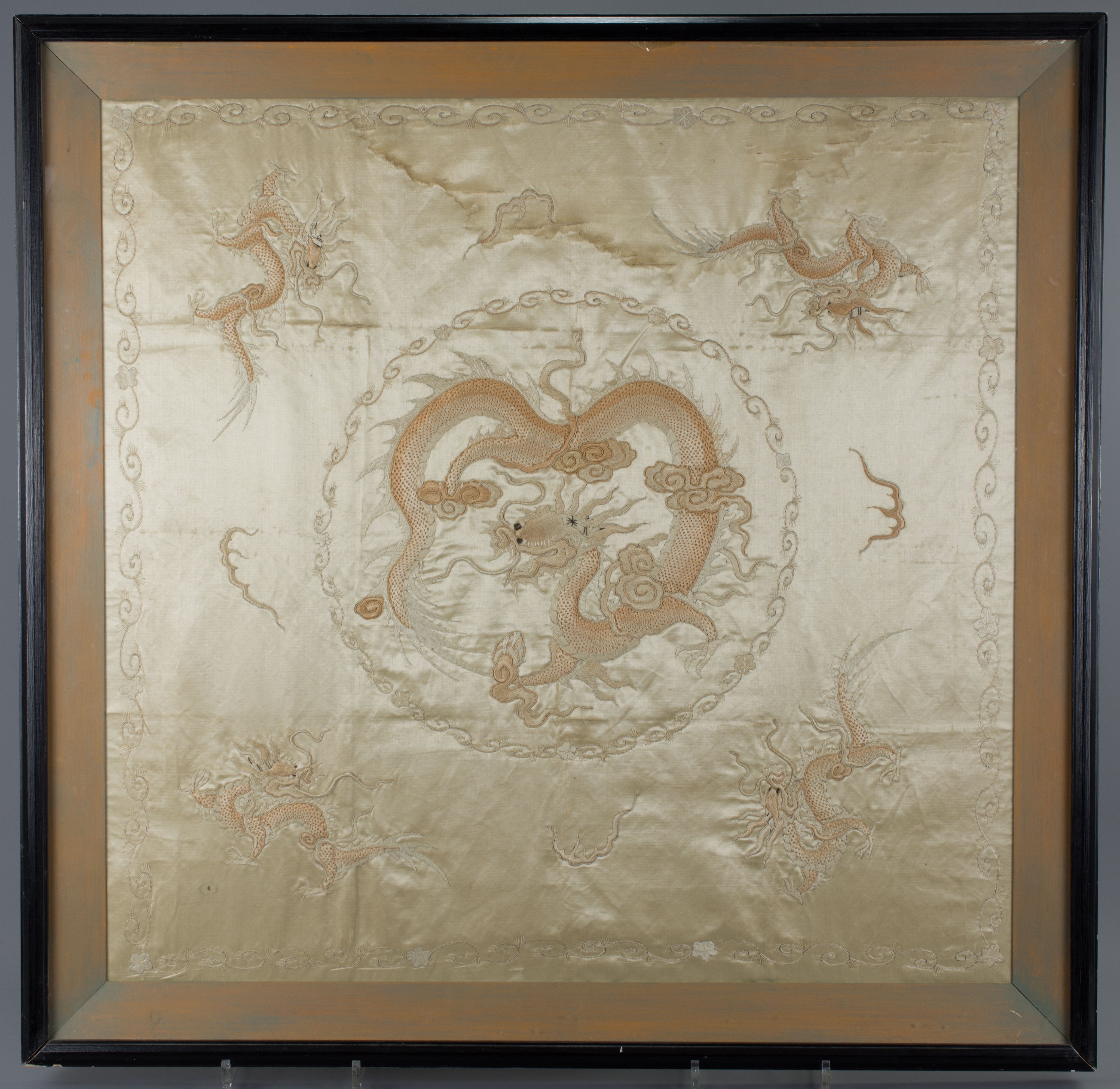 A large Chinese early 20th century framed embroidery of a Dragon.