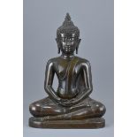 A Thai 18th/19th century seated bronze buddha. 49cm tall