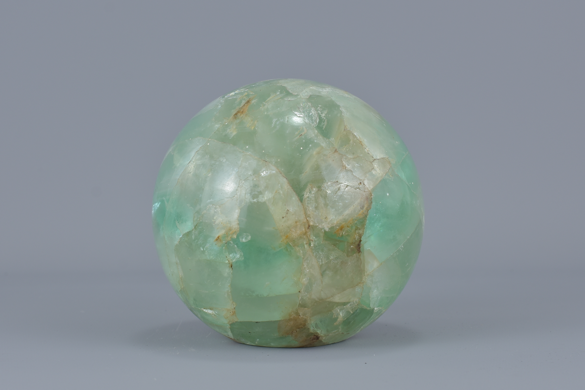 A Chinese green quartz stone ball hollowed. 6.5cm x 6.5cm