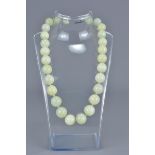 A string of celadon jade beads