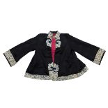 A Chinese 20th century silk embroidered jacket. 68cm tall