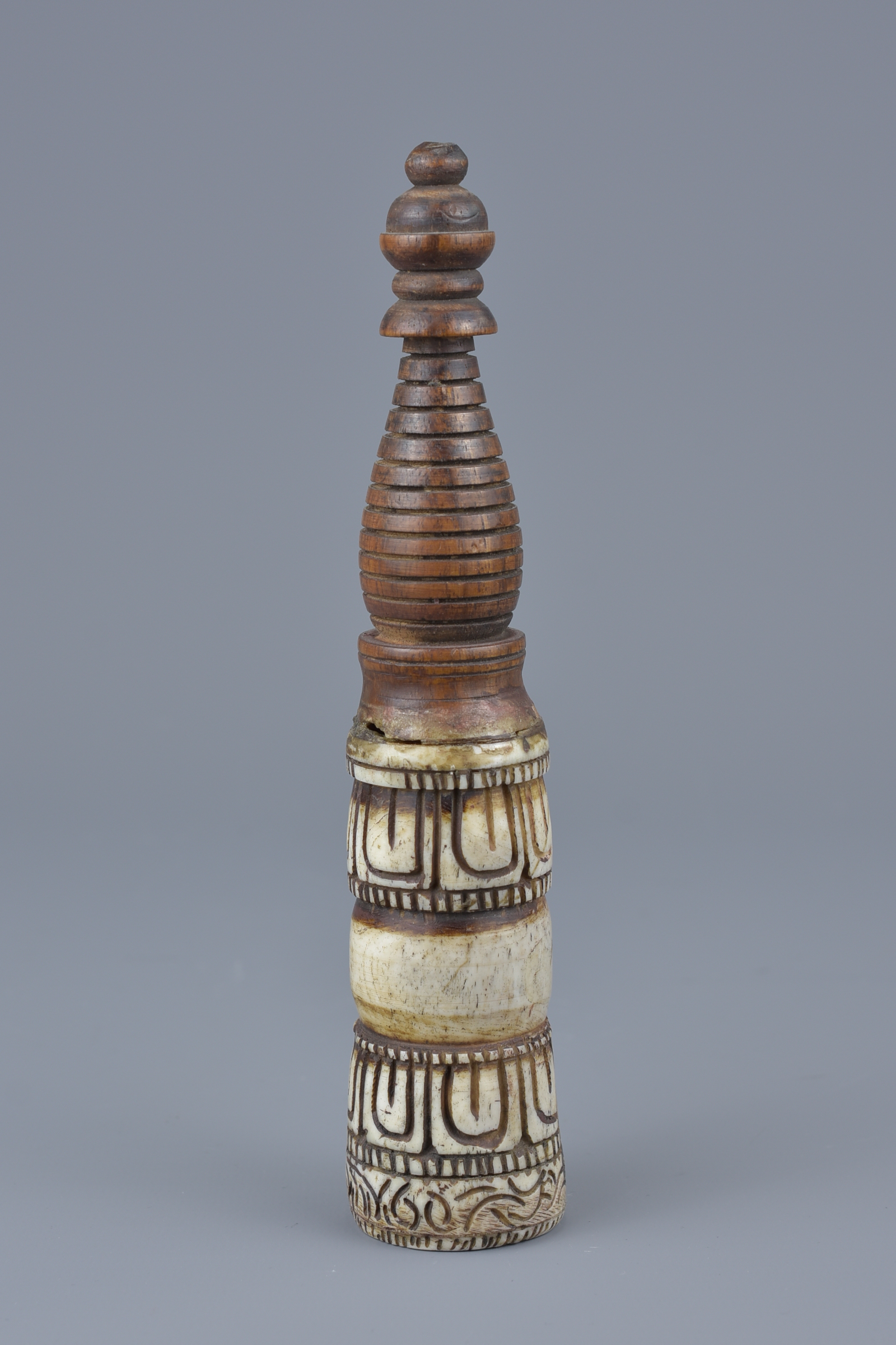 A Tibetan seal carved in wood with spiral handle. 7cm height