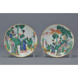 A pair of Chinese 19th century Kangxi style porcelain dishes painted with figures. 13 cm  diameter.