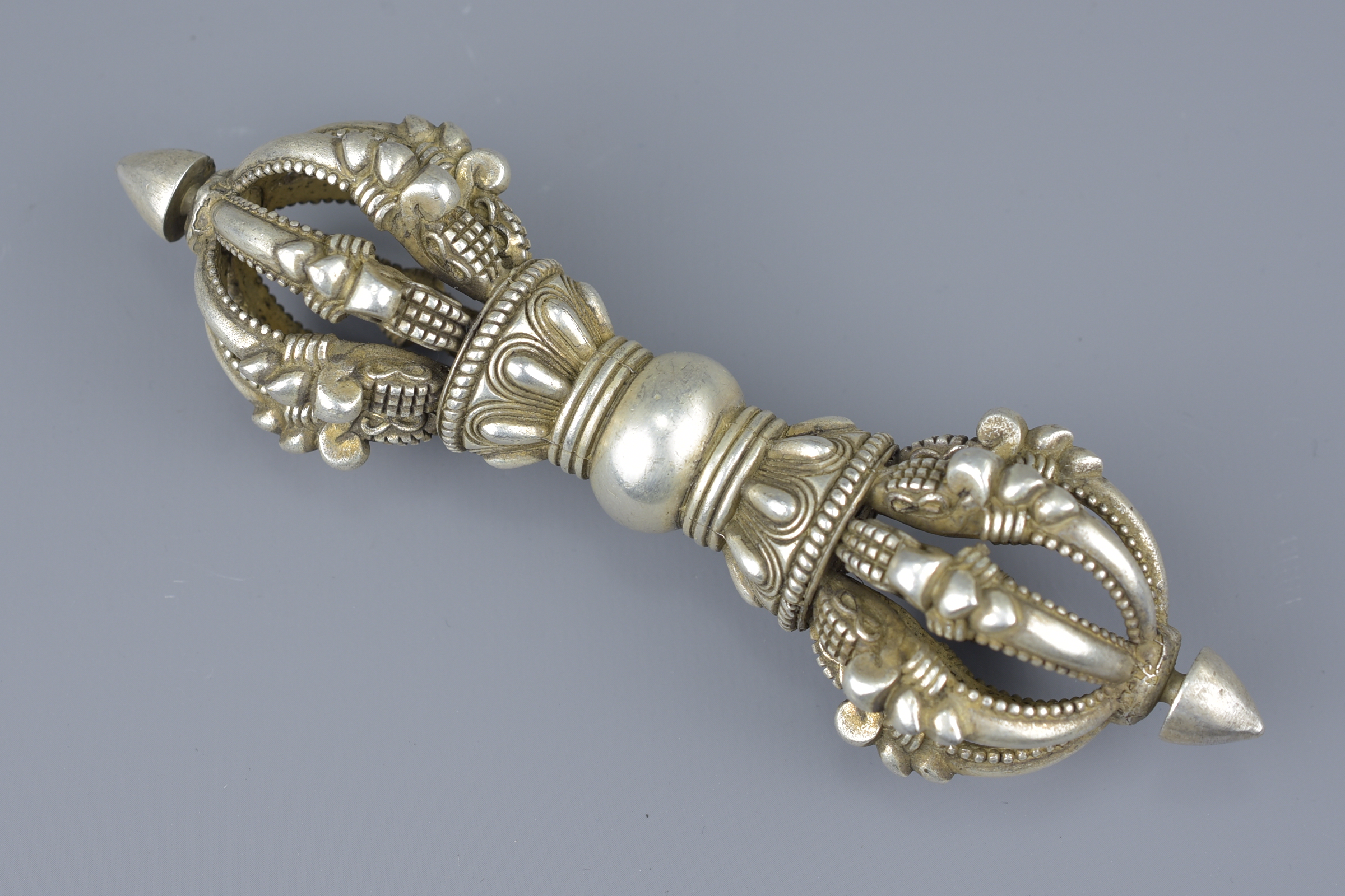 A Tibetan white metal Vajra. 15cm width