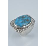 A large turquoise and silver ring stamped 925. Size R