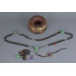 A 19th century Chinese official court jewellery. Four large jade beads attached to wooden beads and