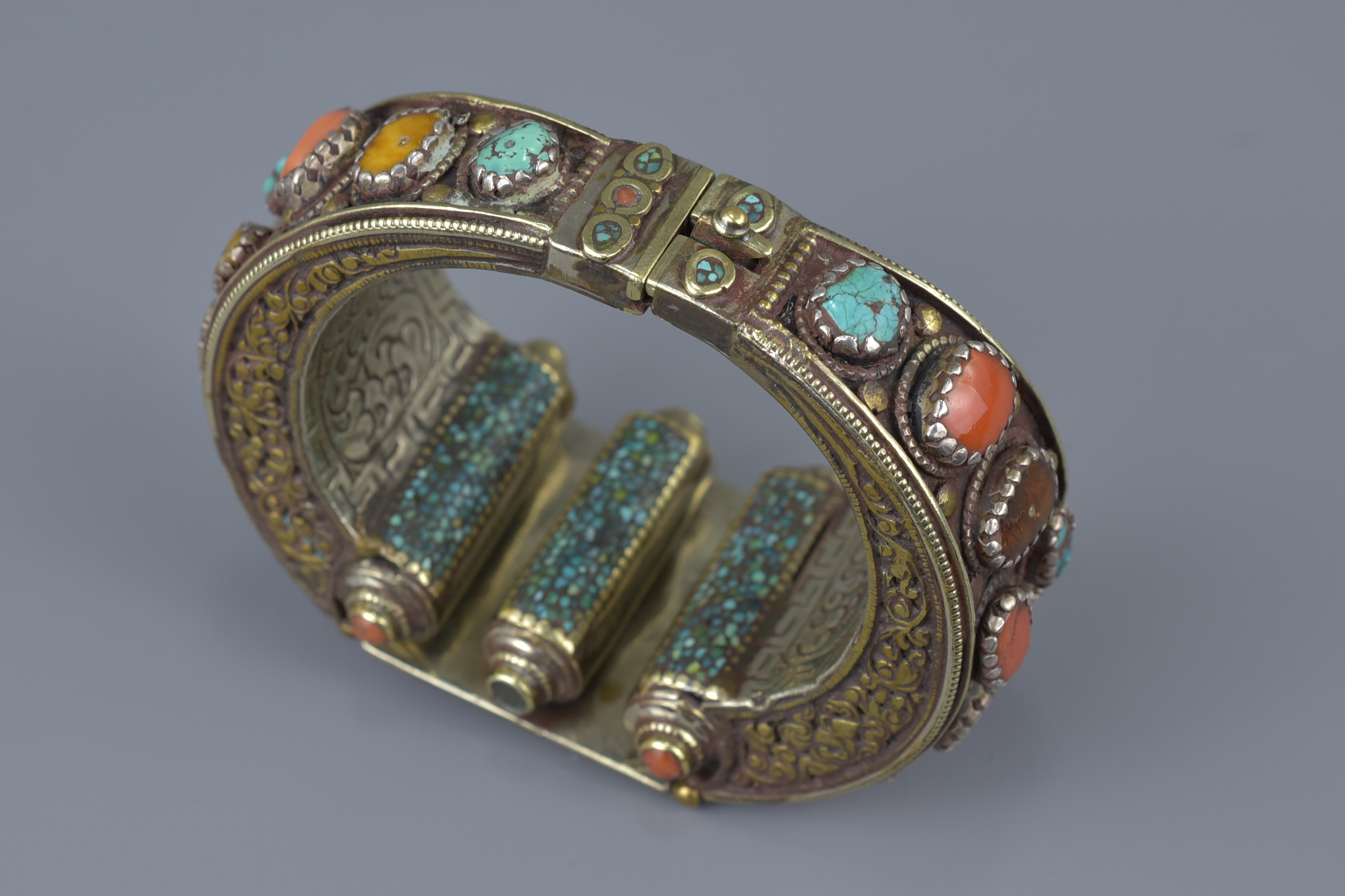 A Tibetan metal bracelet with various stone inserts. - Image 3 of 5