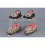 Two pairs of Chinese 19th century embroidered banded shoes with forbidden stitch pattern design.