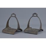 A pair of antique Islamic 19th century cast iron horse stirrups. 18cm height