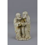 A 18/19th century jadeite figure carved as two Lohan with scroll. 10cm height.