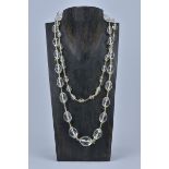 A string of graduated antique art deco rock Crystal beads in a necklace.
