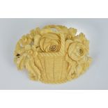 An antique Ivory Brooch in the form of a basket of flowers.