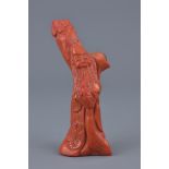 A Chinese carved coral of a man standing by a tree. 12cm