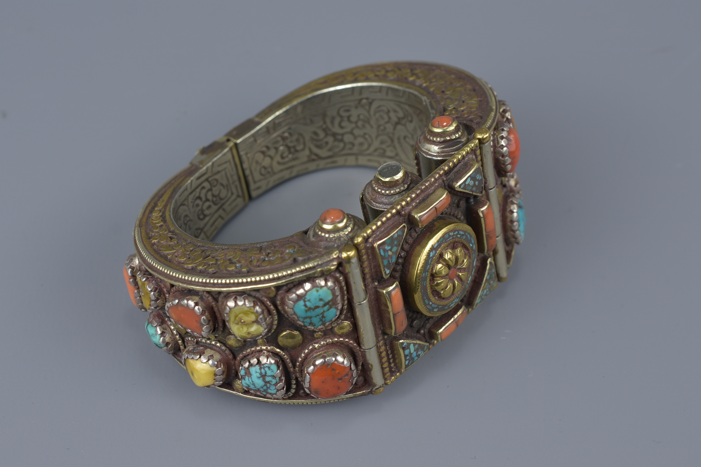 A Tibetan metal bracelet with various stone inserts. - Image 2 of 5