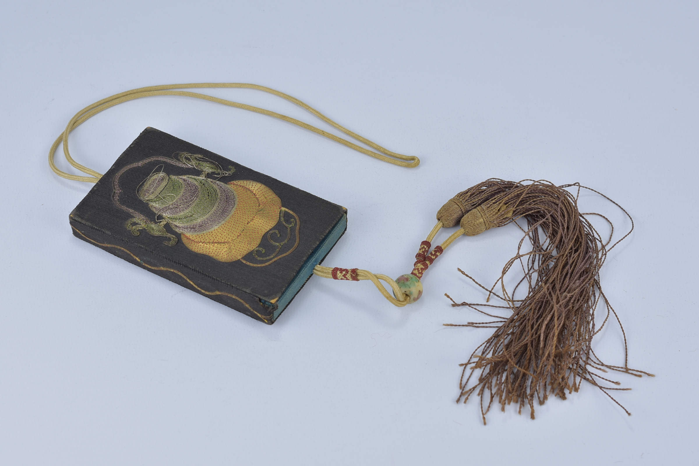 A 19/20th century Chinese embroidered card case with tassel and wire decoration. - Image 2 of 3